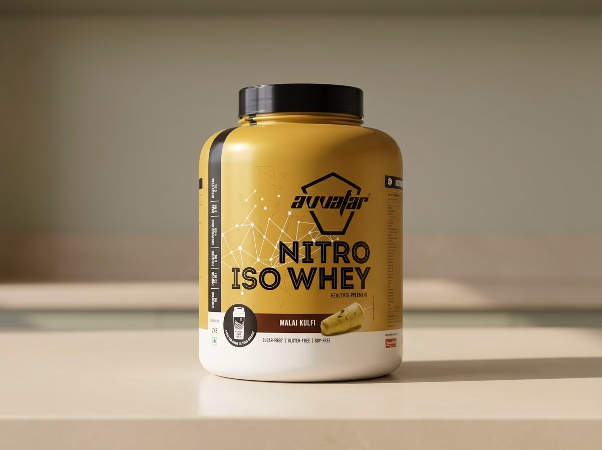 Avvatar Nitro Iso Whey 2 kg Malai Kulfi tub with creatine, on a kitchen counter