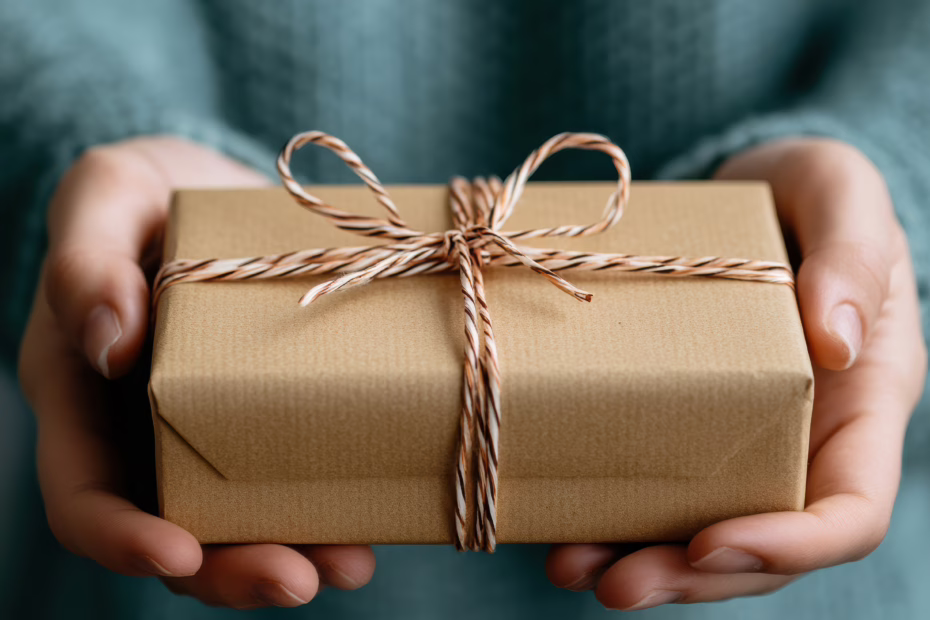 A beautifully wrapped eco-friendly gift box with handmade items, representing the concept of Slow Gifting